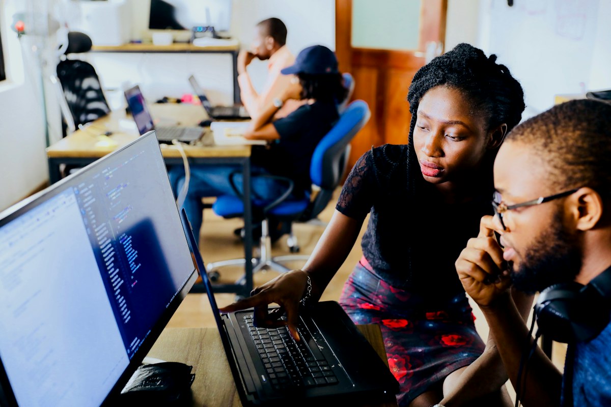 Engineers working together at computers