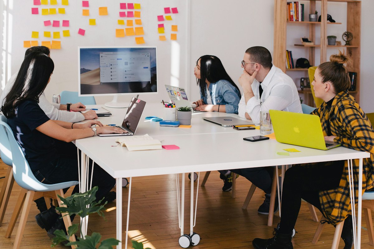 Colleagues reviewing work together in an office